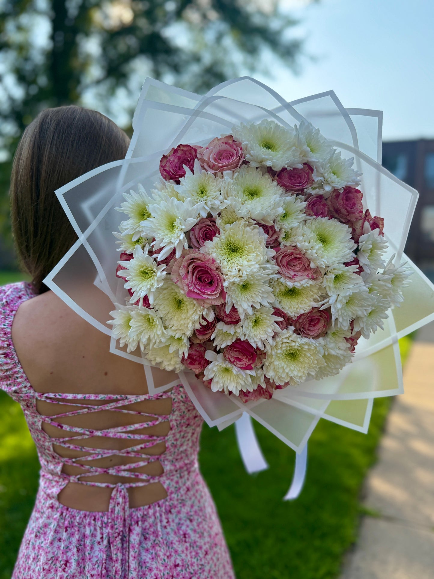 A bouquet of roses and chrysanthemums