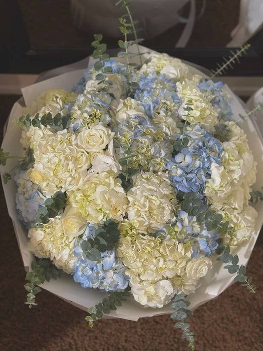 A bouquet of hydrangeas and roses