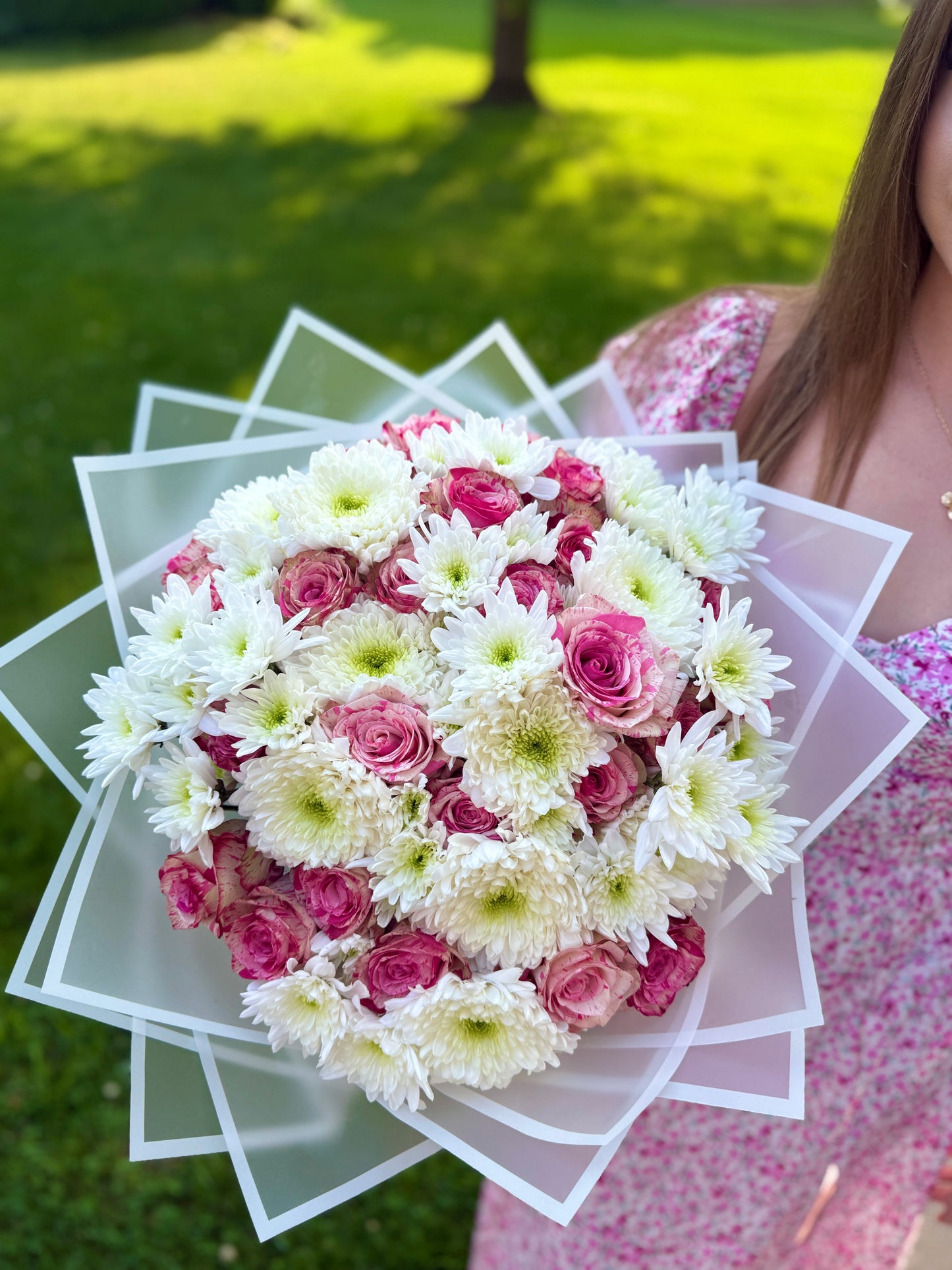 A bouquet of roses and chrysanthemums