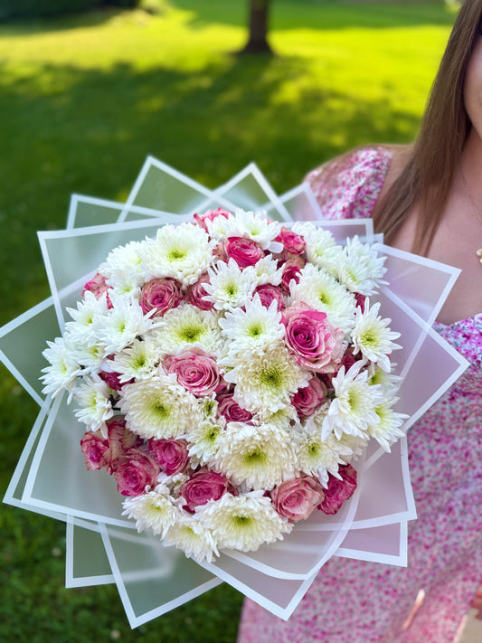 A bouquet of roses and chrysanthemums