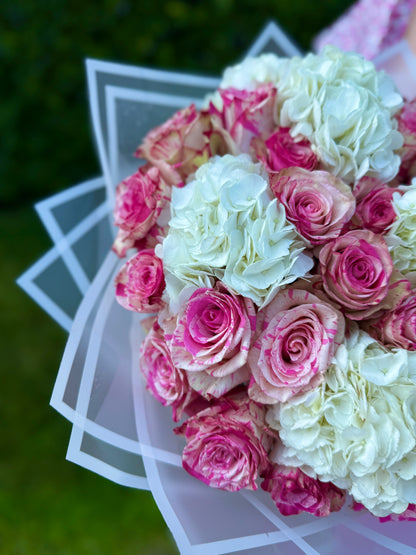 A bouquet of roses and hydrangeas
