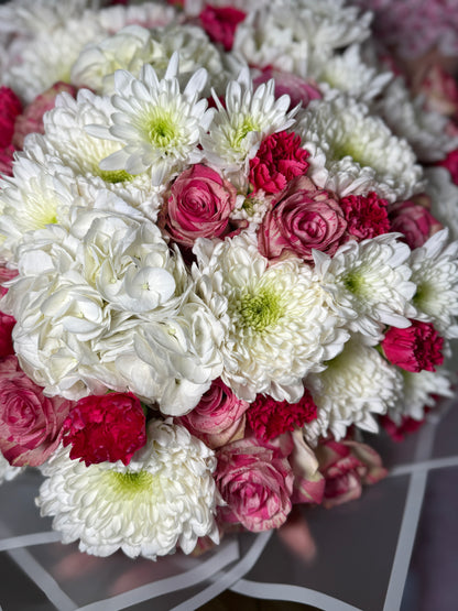 A bouquet of roses, hydrangeas, chrysanthemums and carnations