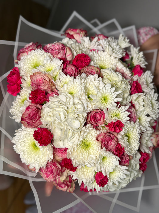 A bouquet of roses, hydrangeas, chrysanthemums and carnations