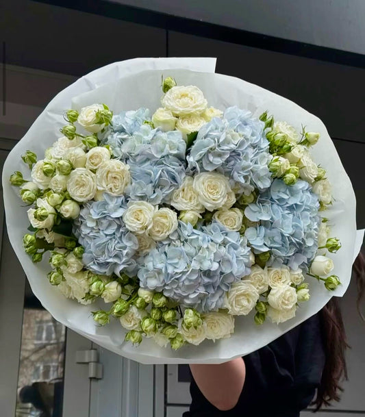 White spray roses and blue hydrangeas